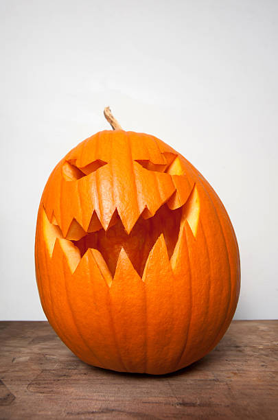 istock Carved pumpkin with a scary face 494292004
