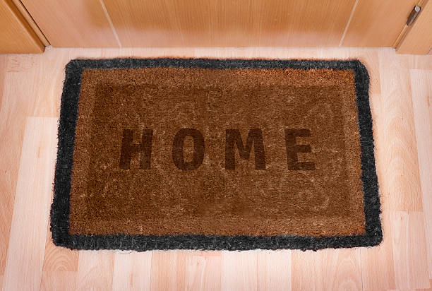 istock Welcome home doormat with closed door 494293881