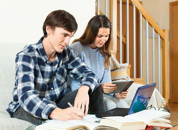 istock Guy and girl reading books 494293975