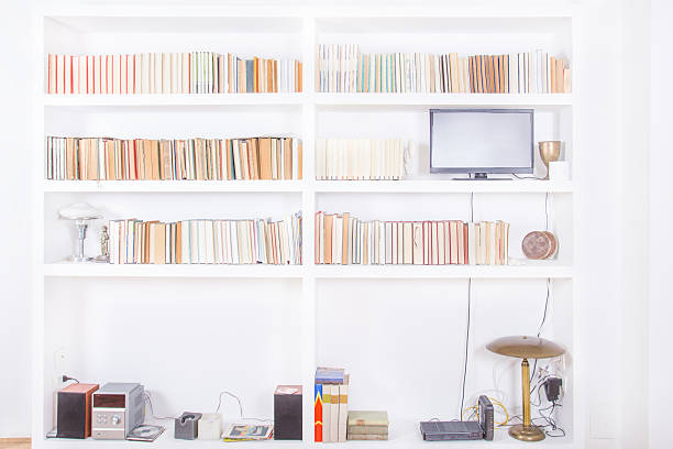 white living room with modern wooden bookshelf stock photo