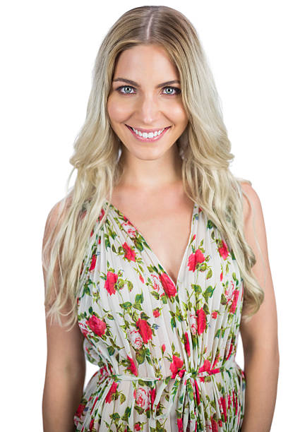 istock Cheerful blonde wearing flowered dress posing 494296699