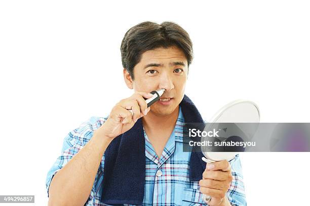 Man Using Nose Hair Trimmer Stock Photo - Download Image Now - Adult, Adults Only, Asian and Indian Ethnicities
