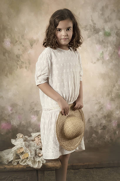Sweet victorian girl posing in the old style