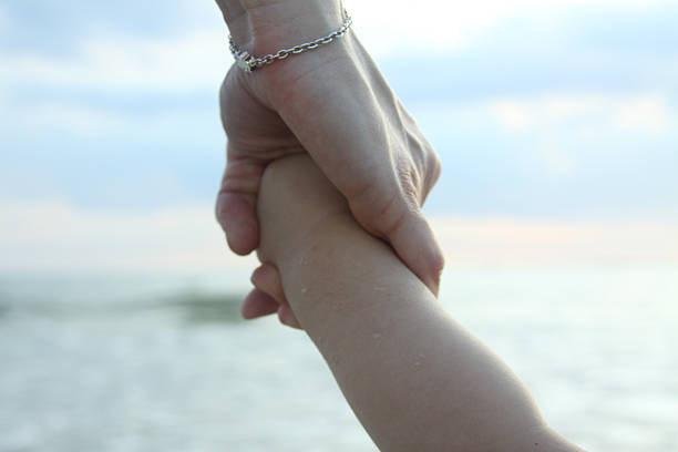 istock First year playing sea breast confidence baby hands connection protection 494301005