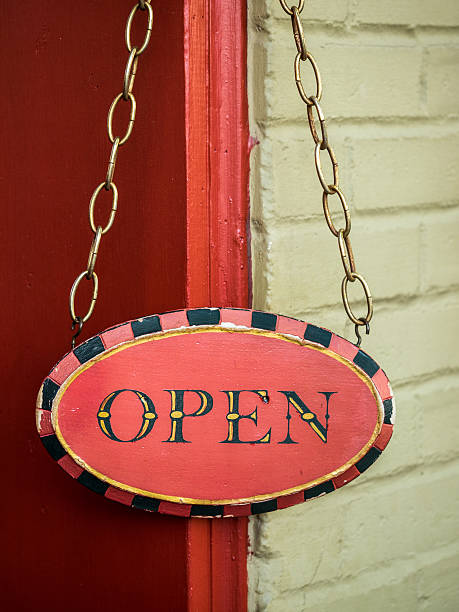 istock OPEN Sign Hanging Outside Retail Shop 494305298