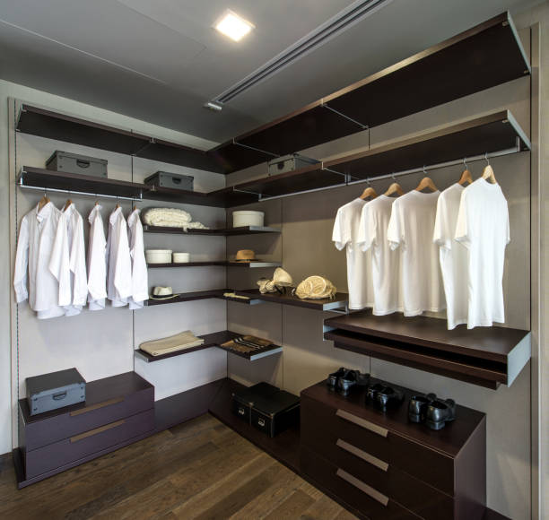 Large walk-in closet with shelves stock photo