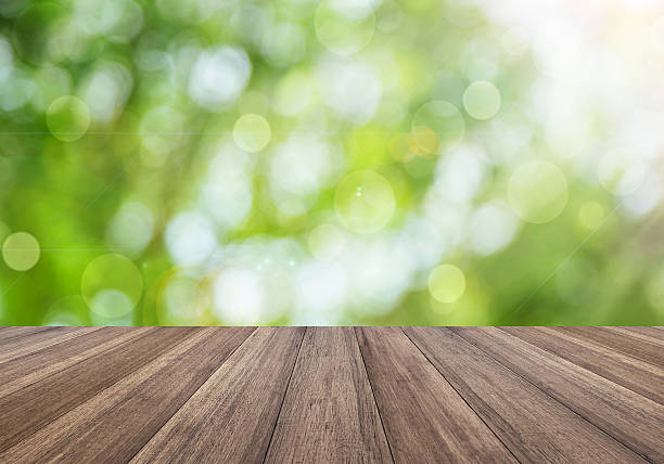istock bright spring with sunlight bokeh background and perspective wooden plank 494309748