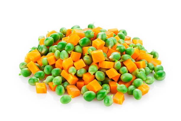 Green Peas and Carrot Green Peas and Carrot Heap Isolated on White Background pile of carrots stock pictures, royalty-free photos & images