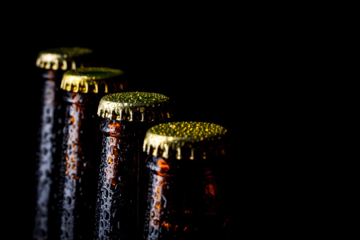 Close up bottles of beer on a black background