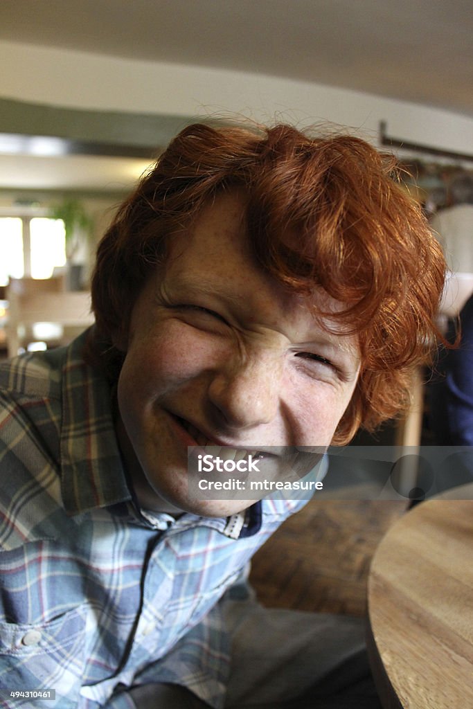 Teenage Boy Pulling A Funny Face Looking Ugly And Silly Stock Photo