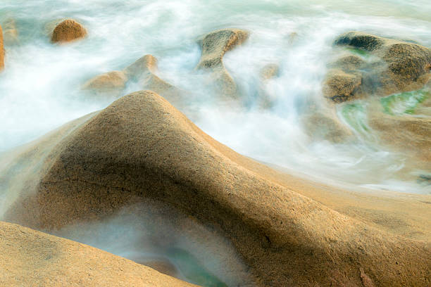 Long exposure of wave crashing on the rock in Co Thach Beach, Vietnam