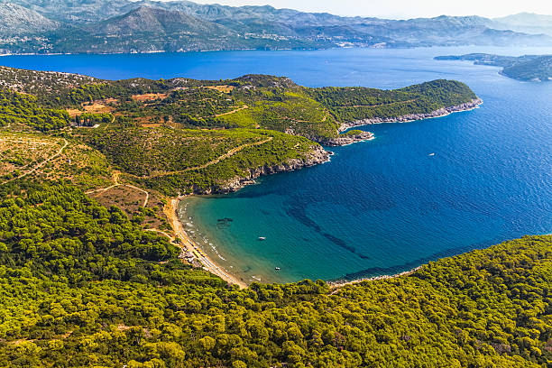 Elaphites near Dubrovnik Sandy beach on Elaphites island Lopud with a view to the Dubrovnik archipelago. dubrovnik lopud stock pictures, royalty-free photos & images