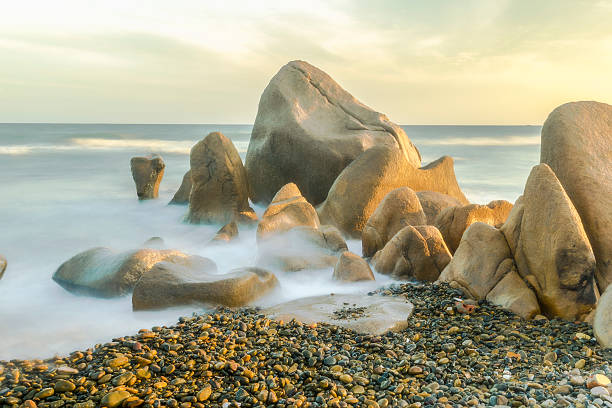 Long exposure of wave crashing on the rock in Co Thach Beach, Vietnam