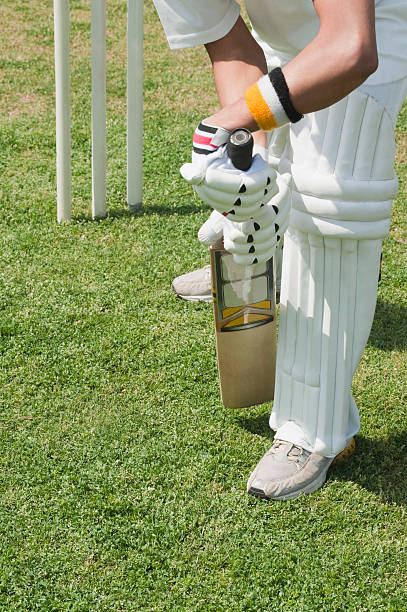 Cricket batsman playing a defensive stroke Cricket batsman playing a defensive stroke batsman photos stock pictures, royalty-free photos & images