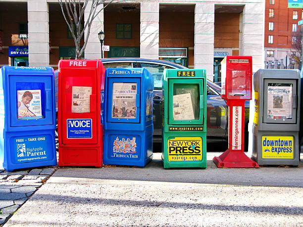 Berlin, Germany - November 16, 2011: The french newspapers Le Figaro and Le Monde together with others germans daily newspapers on a newsstand next to the French embassy.