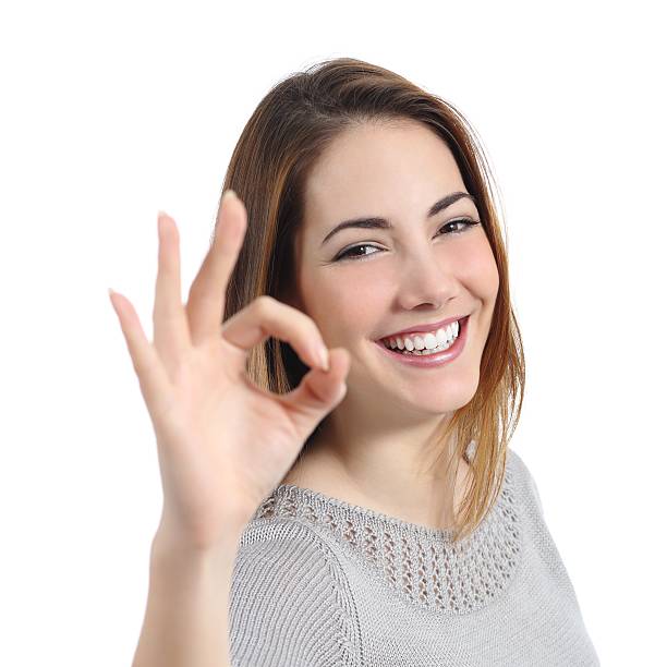 istock Happy woman with perfect smile gesturing ok 494312843