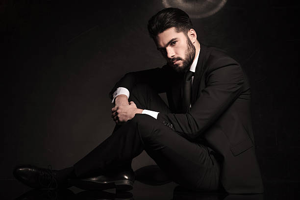 istock dramatic business man sitting on the floor 494313381