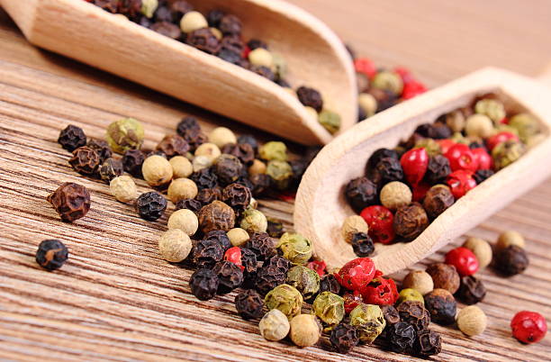 istock Fresh colored pepper with spoon on wooden background 494314042