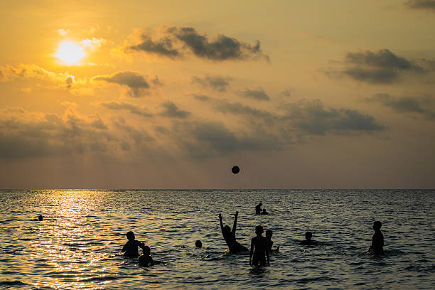istock silhouetted group of boy are playing 494314433