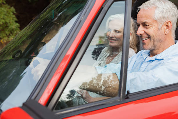 istock Happy mature man having a ride with his wife 494314489