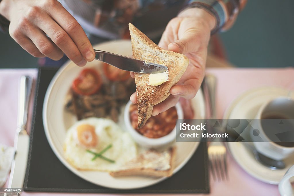 Eating breakfast Closeup on a young woman's hands as she is having breakfast Breakfast Stock Photo