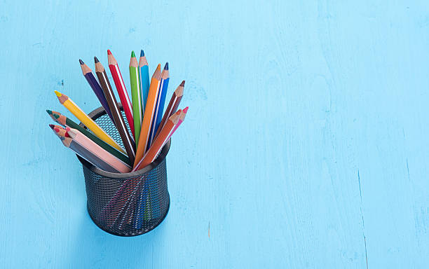 istock colorful pencils on blue background 494315476