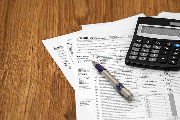 istock Tax form with pen and calculator 494317706