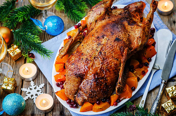 istock Duck baked with apples, pumpkin and cranberries 494318452