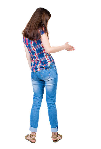 istock back view of woman shake hands 494318536