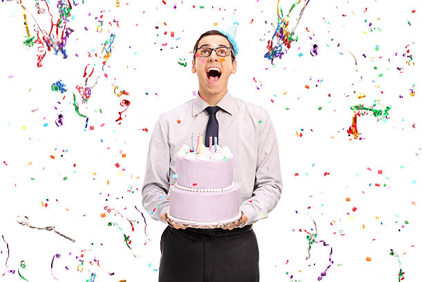 istock Delighted man holding a birthday cake 494318702