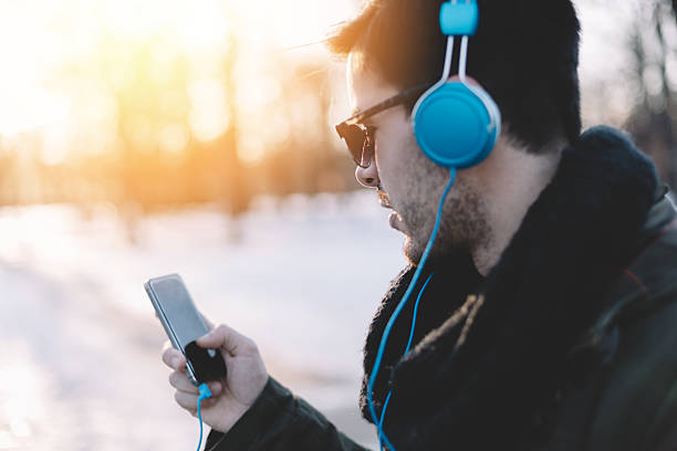 istock Man enjoying the music from mp3 player 494319750
