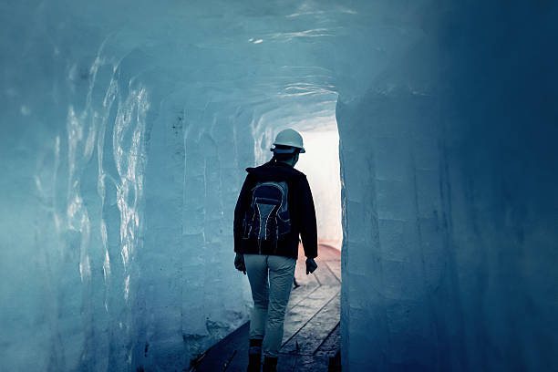 istock Scientist at an Expedition Site Examining a Glacier 494338862