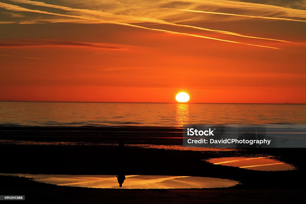 Twilight Silhouette Summer sunset beach reflections on North West Englands Fylde Coast Riviera Water Stock Photo