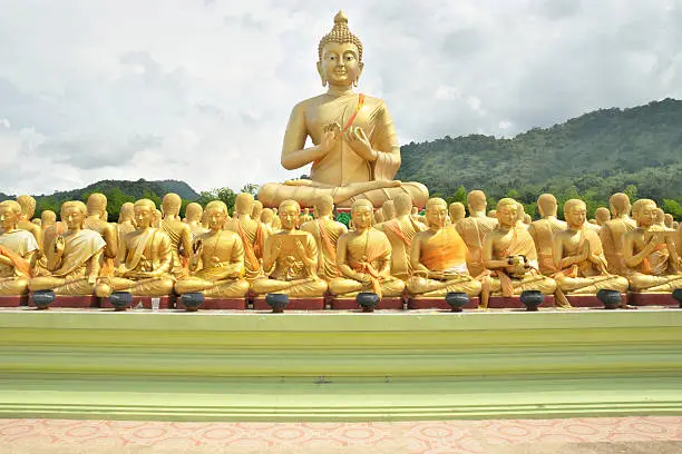 Magha Puja temple. An outdoor temple with 1250 buddha images, alms-bowls of important Figure and one Large Buddha lord image. The bowl is painted with name of important of arahant in Magha Puja event.