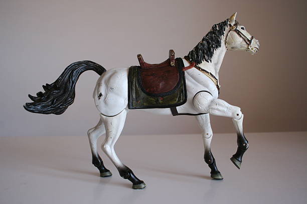istock White horse toy walking 494343124