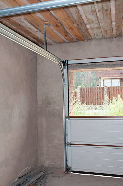 istock Garage Door Post Rail and Spring Installation, Assembly Interior 494343220