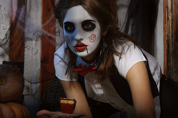 istock Witch holding a candle in her hand 494343580