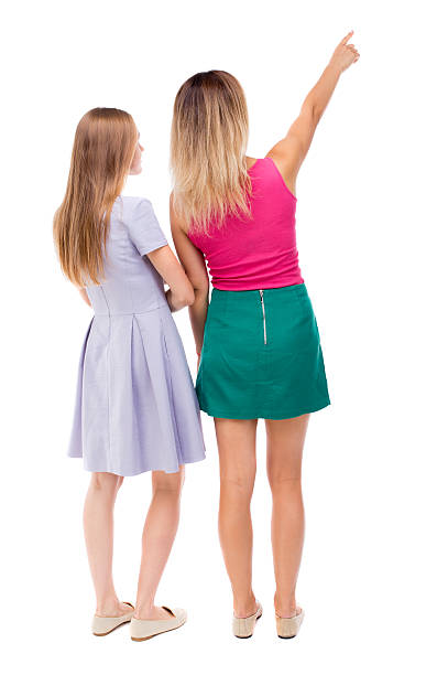 istock Back view of two pointing young girl. 494345244