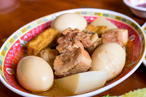 Vietnamese Traditional Food: Caramelised pork belly with hard-boiled eggs braised in coconut water.