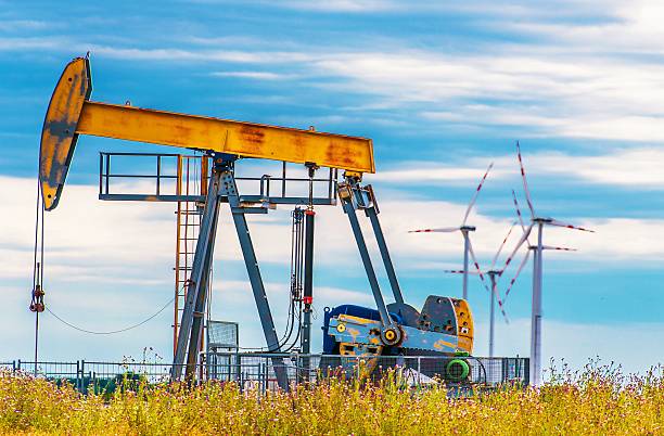 istock Oil Pump and Wind Turbines 494346118