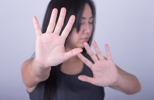 woman showing her denial with NO on her hand