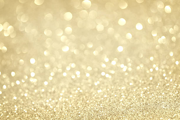 istock gold glittering christmas lights. Blurred abstract background 494347032