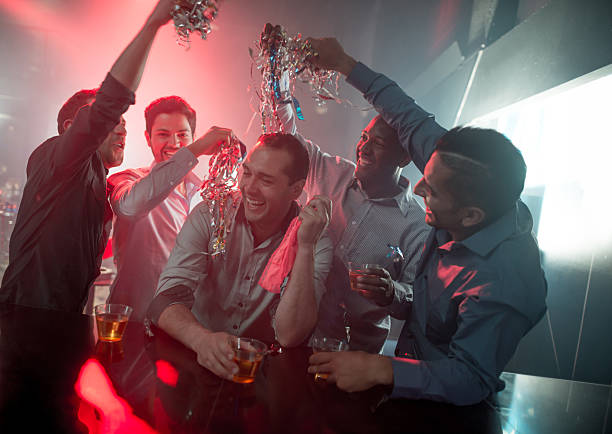 Happy group of men at a bachelor party Happy group of men at a bachelor party at a nightclub having fun stag photos stock pictures, royalty-free photos & images