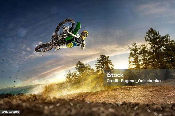 Dirt Bike Rider Is Flying High Stock Photo - Download Image Now - Motorcycle, Extreme Sports, Speed