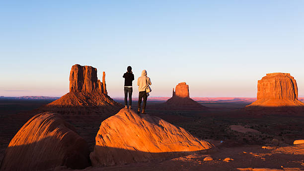 Exploring the Monument Valley sunset in Monument Valley, Arizona. natural landmark photos stock pictures, royalty-free photos & images