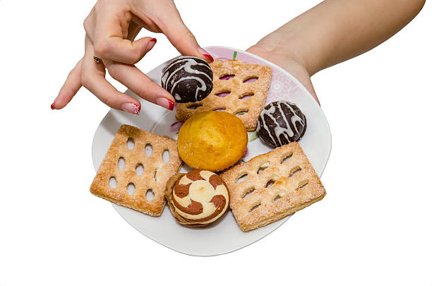 istock Hand holding delicious cake isolated on white background 494350190