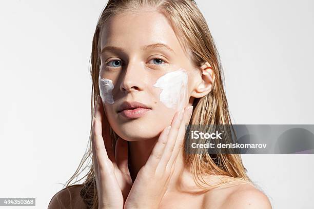 Woman Does A Moisturizer On Your Face Stock Photo - Download Image Now - Moisturizer, Skin Care, Human Face