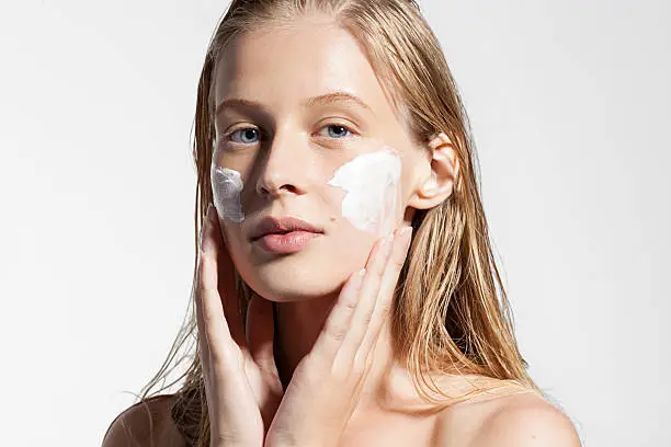 Photo of Woman does a moisturizer on your face