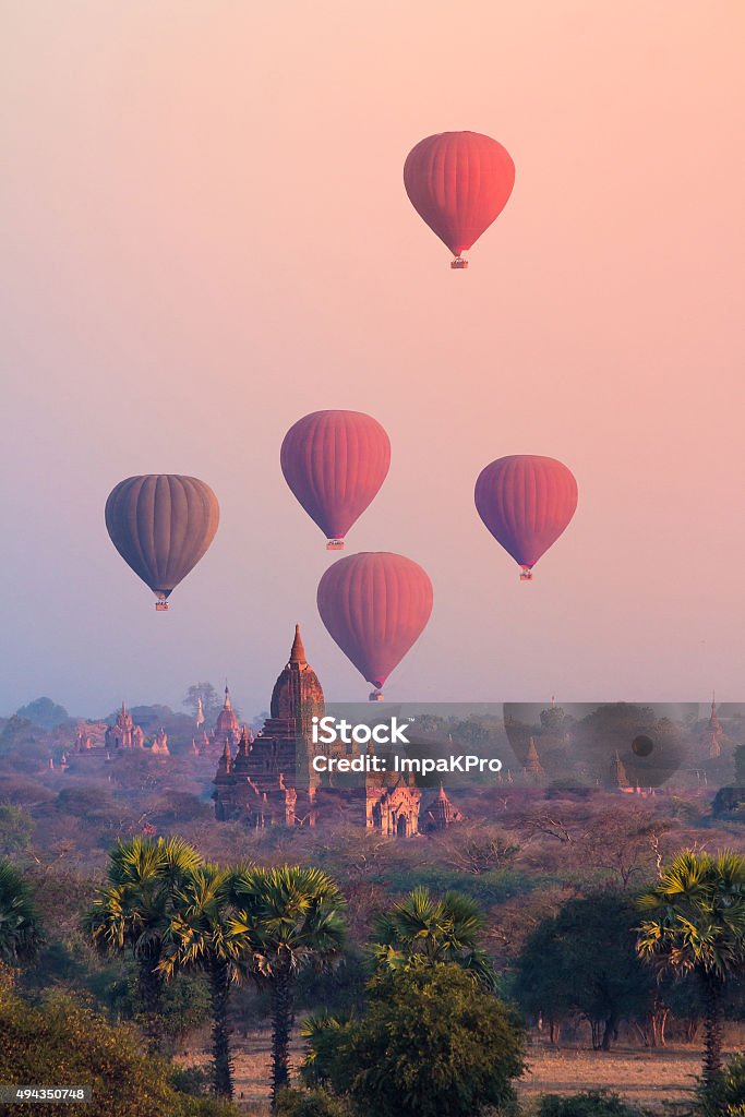 Bagan, Myanmar Hot air balloon over misty morning around Temple in Bagan , Myanmar Myanmar Stock Photo