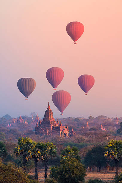 Bagan, Myanmar Hot air balloon over misty morning around Temple in Bagan , Myanmar pagoda photos stock pictures, royalty-free photos & images